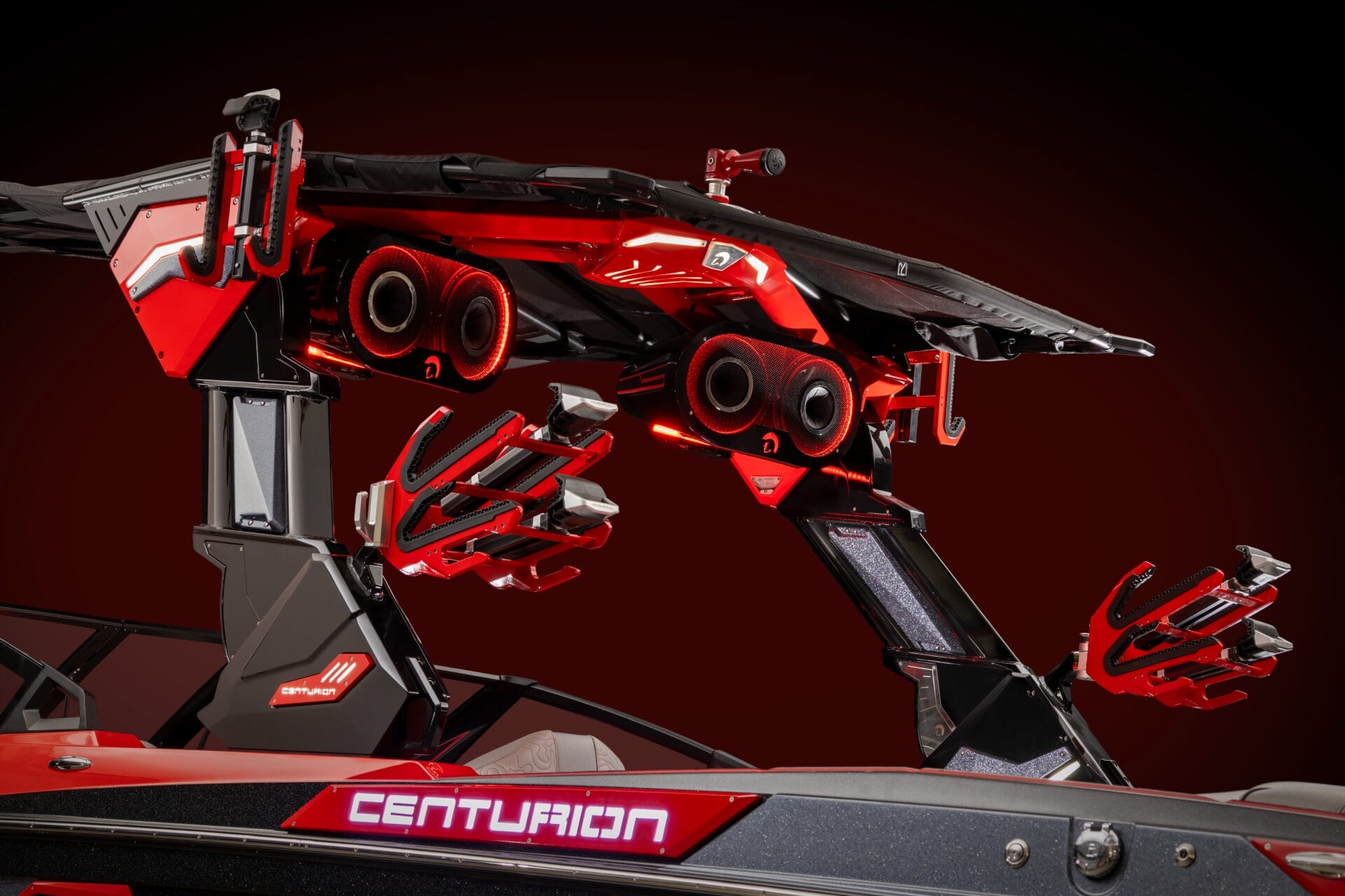 Get up close and personal with the striking red and black Centurion boat tower, stylishly outfitted with speakers and wakeboard racks. It's the ultimate opportunity to customize your ride on the water.