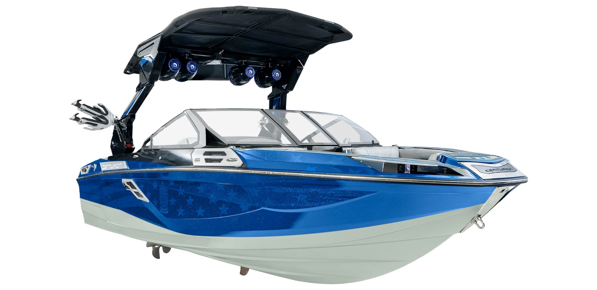 The sleek blue and white Centurion Ri230 speedboat features a black canopy and mounted speakers.