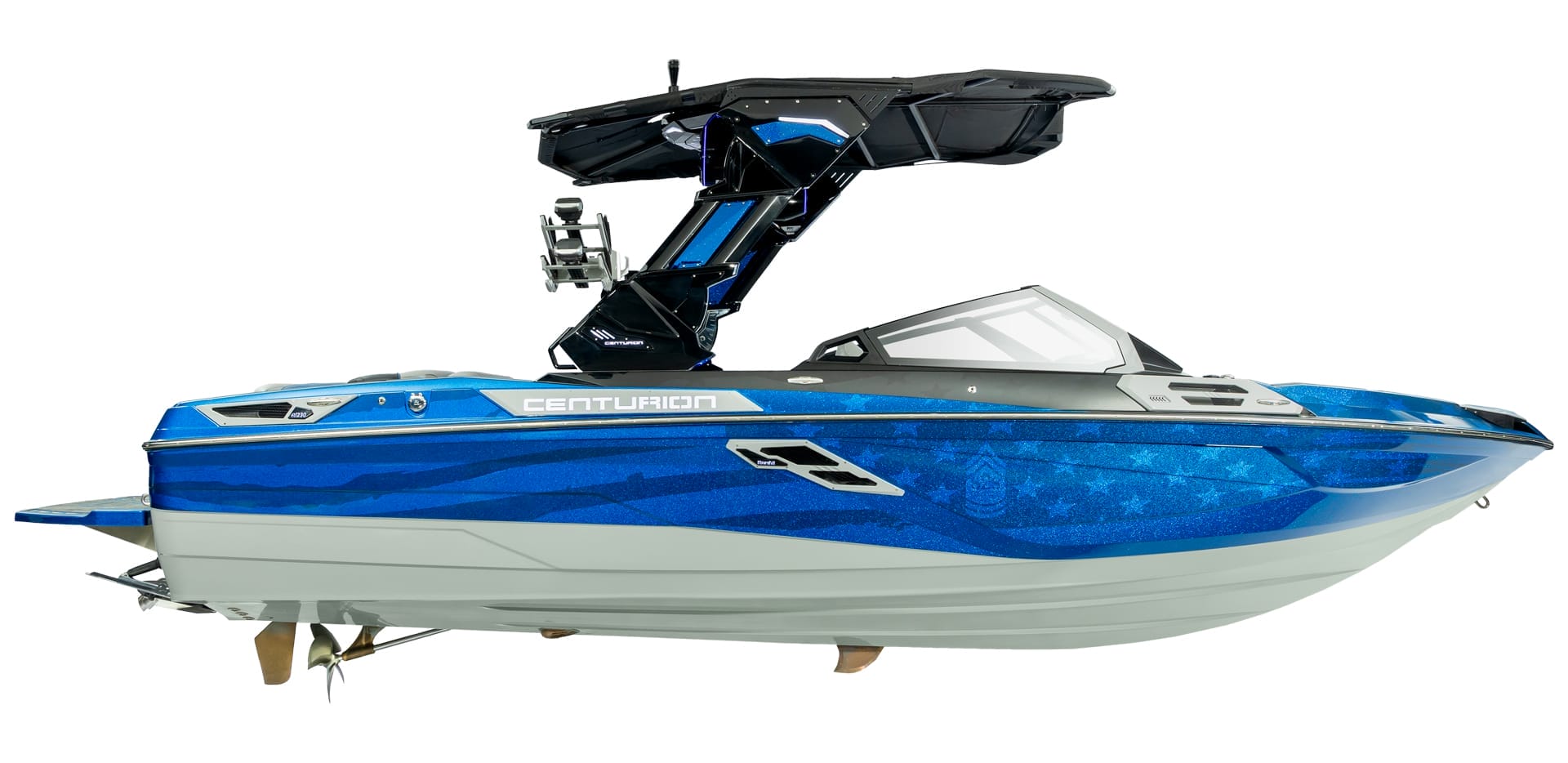 A blue and white Centurion Ri230 powerboat with a wakeboard tower and sleek design, viewed from the side.