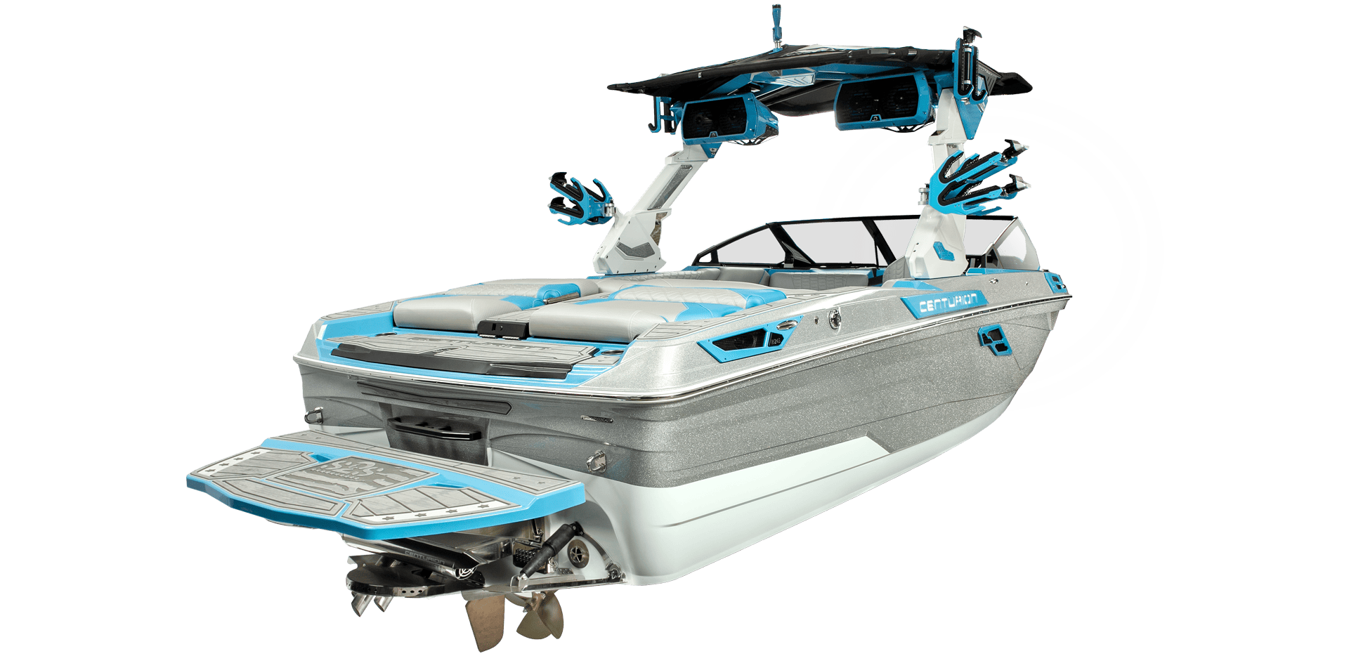 Image of a modern Centurion Ri245 wakeboard boat with a light blue and white color scheme, featuring a wakeboard tower with speakers and a swim platform at the rear.