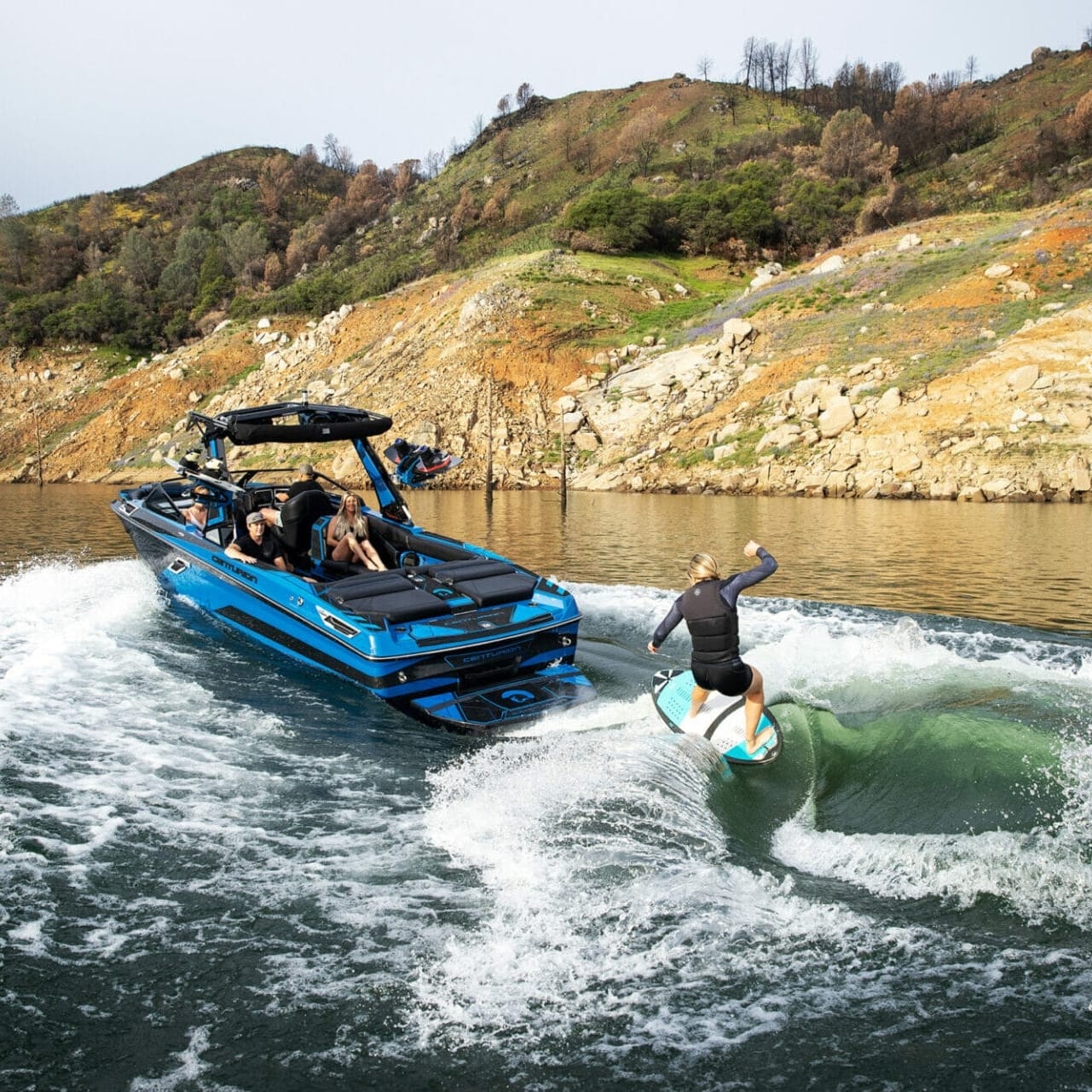 A man is riding a jet ski on a lake.