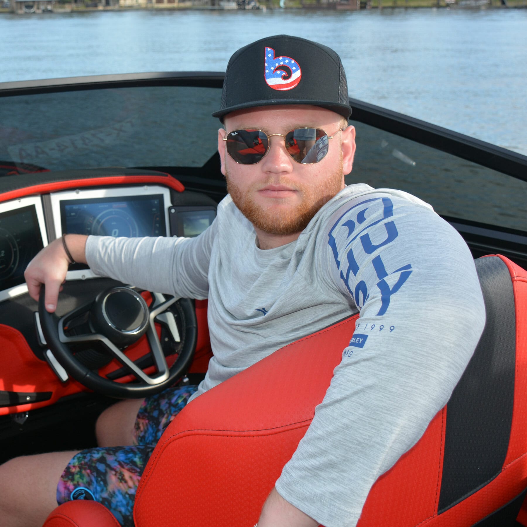 A man on a wakeboat.