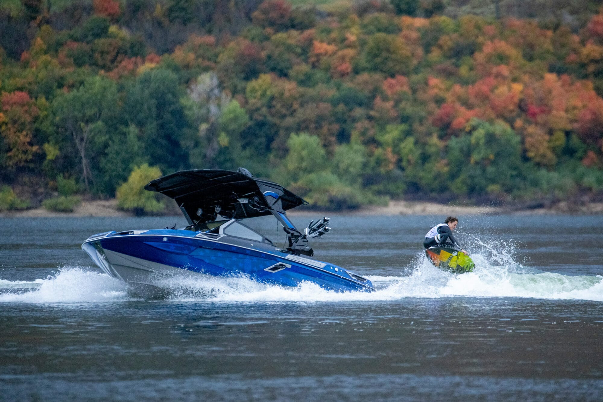 A person is wakeboarding behind a boat.