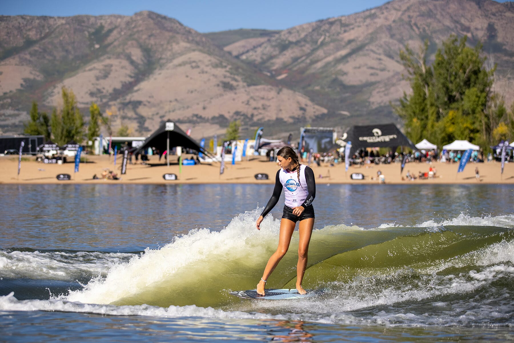 2024 WWSC Day 2 Recap: Woman surfing.