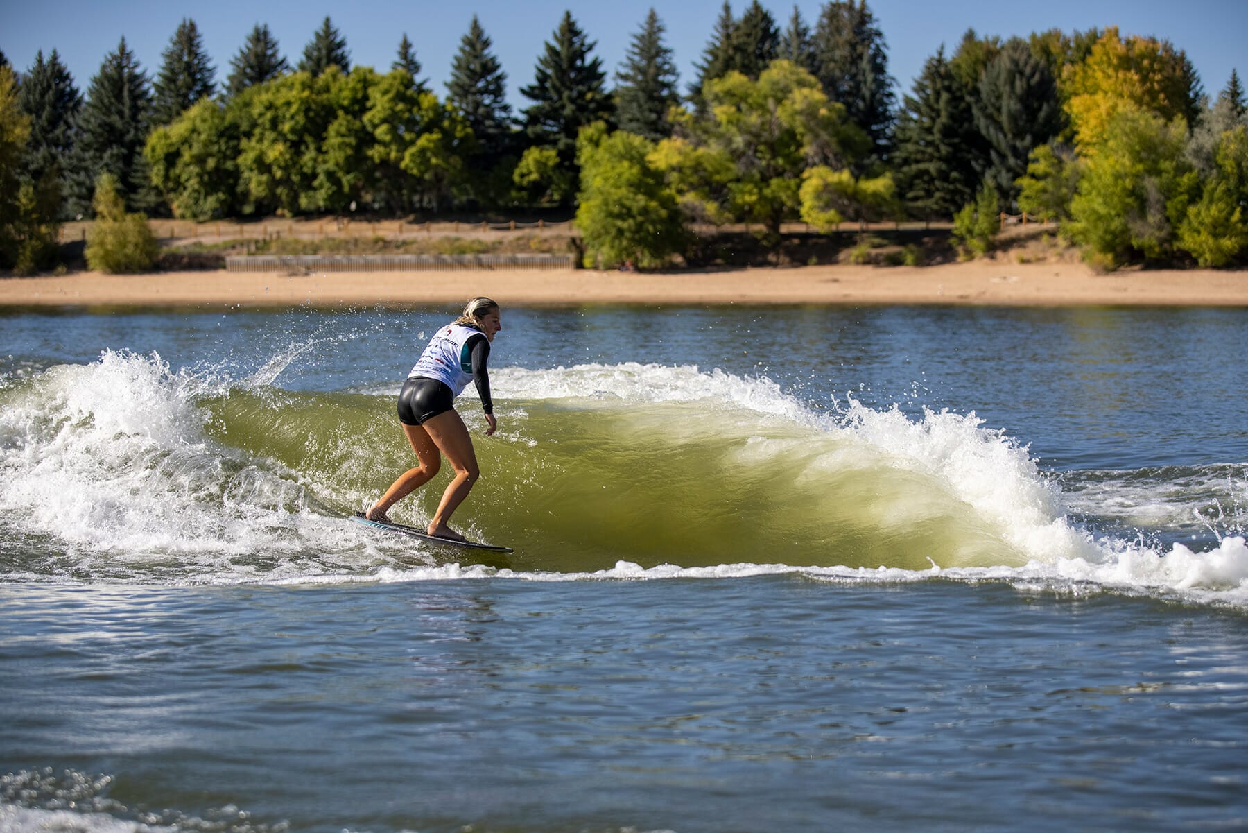 2024 WWSC Day 2 Recap: Woman surfing.