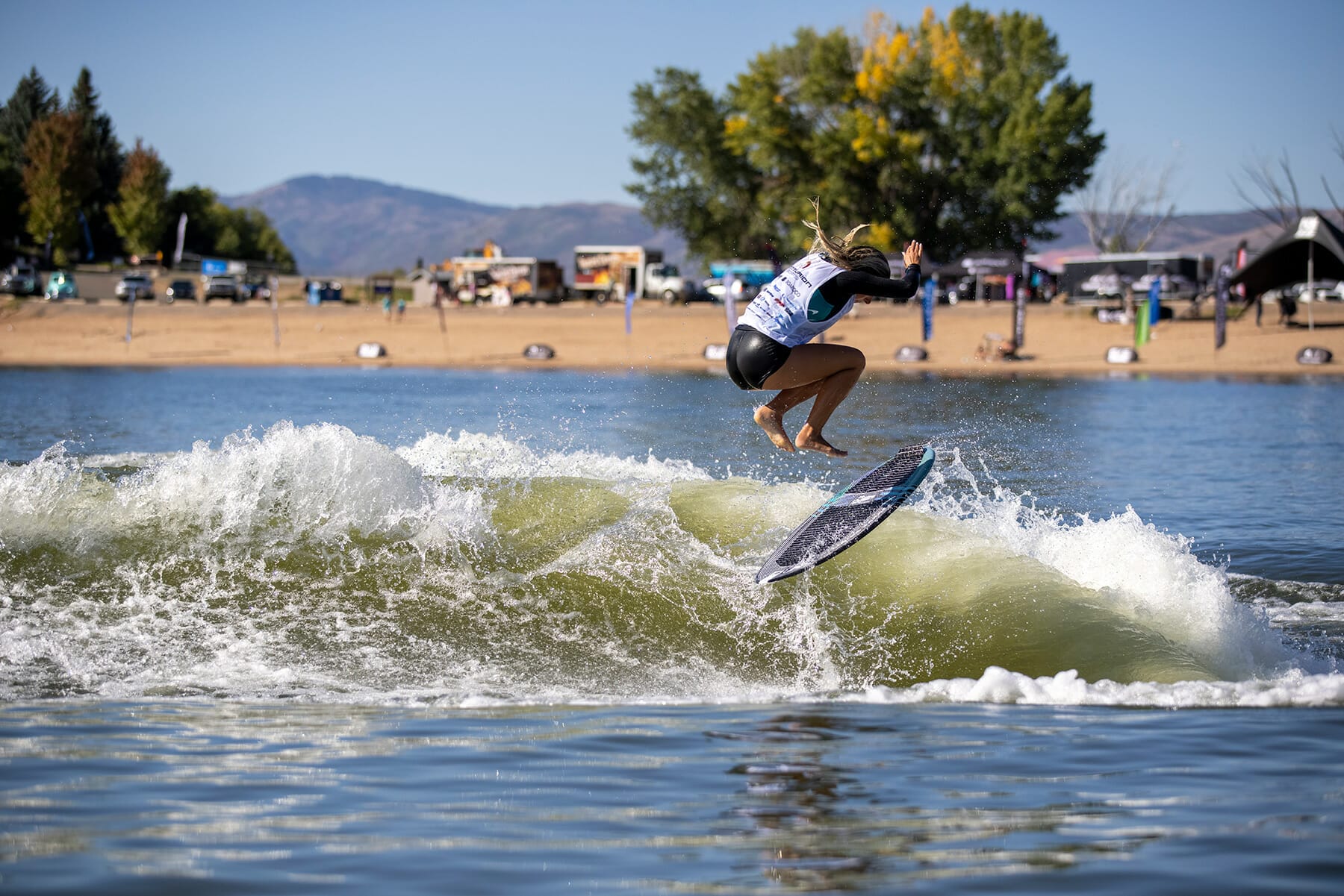 A person surfing in the water at WWSC 2024 Day 2.