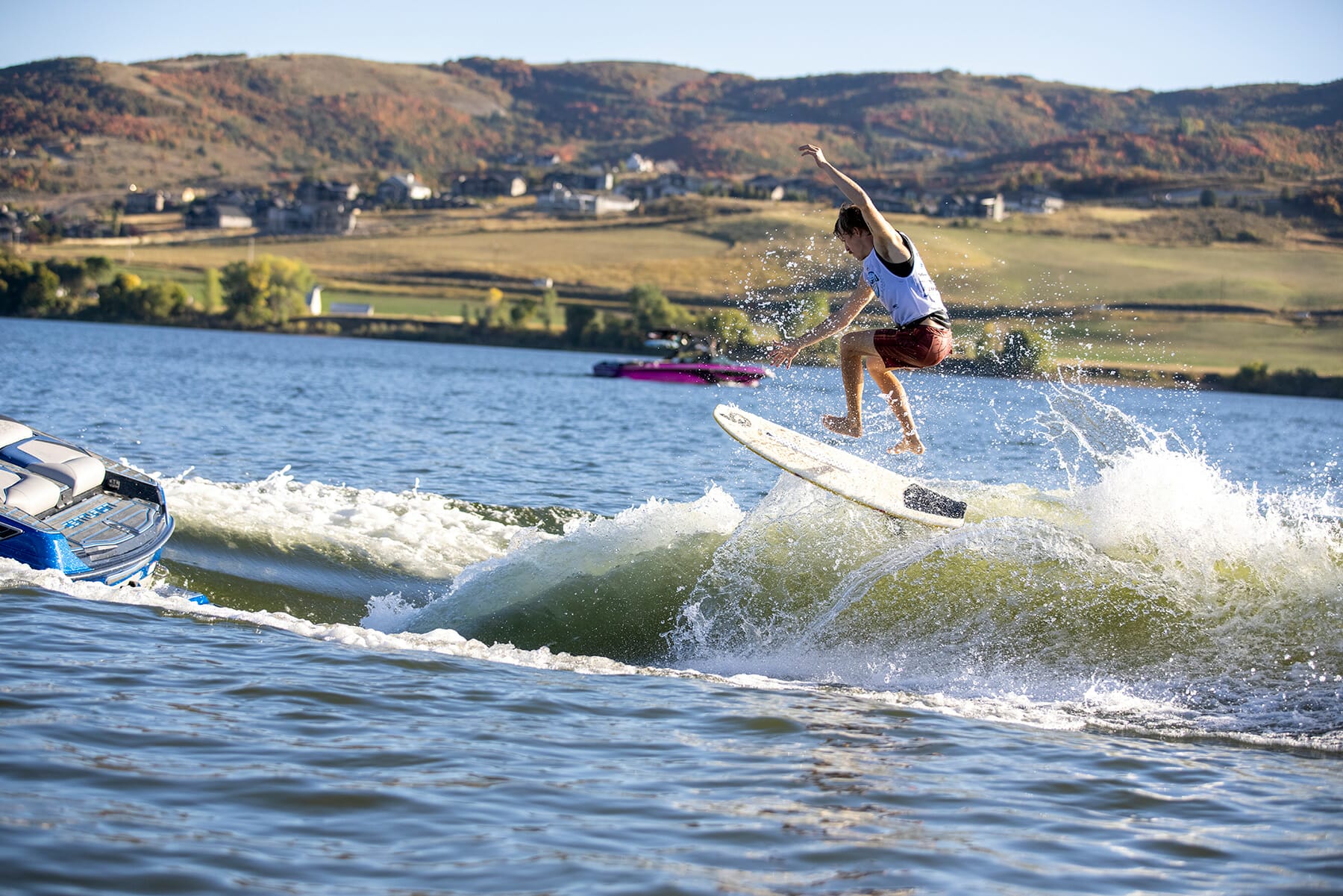 A man is riding a surfboard in the water at the 2024 WWSC Day 2 Recap.