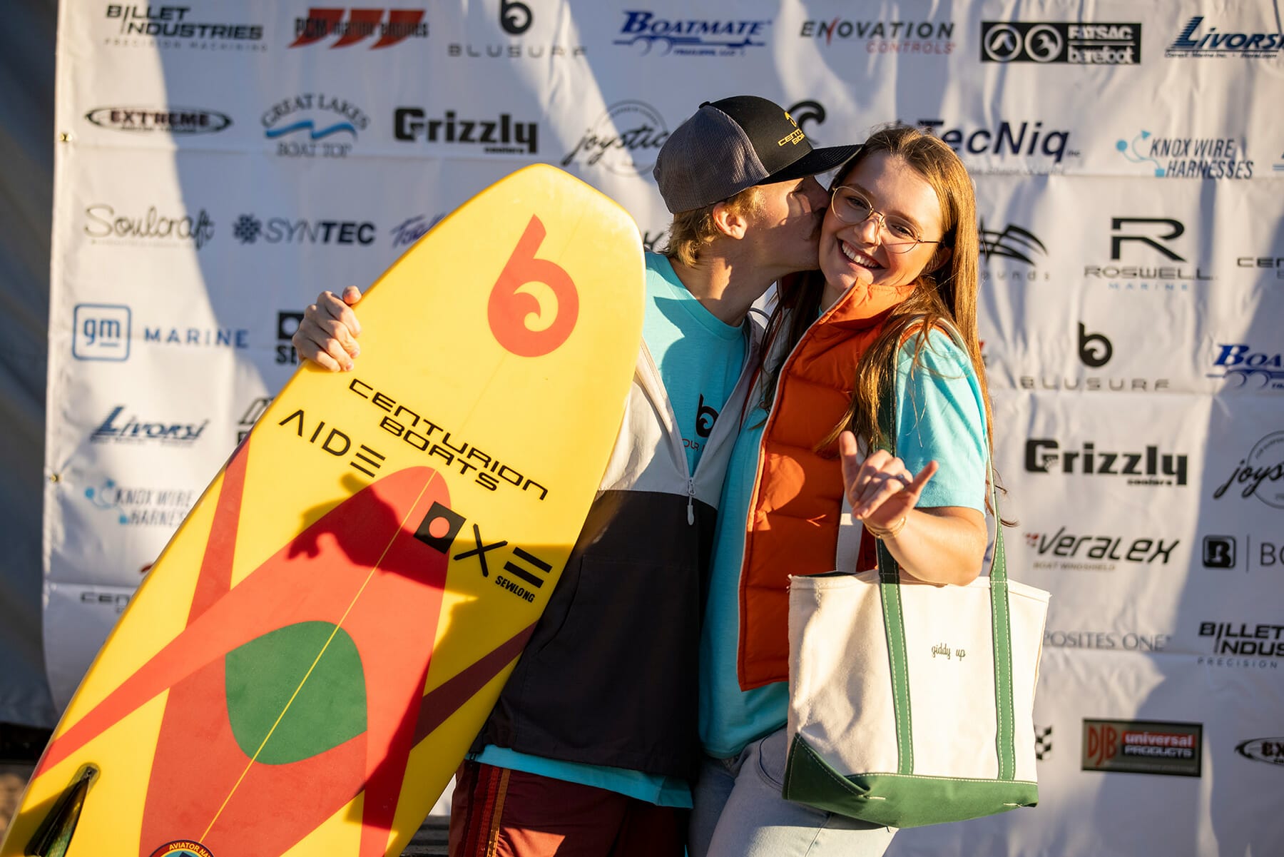 2024 WWSC Day 2 Recap: A woman with a surfboard.