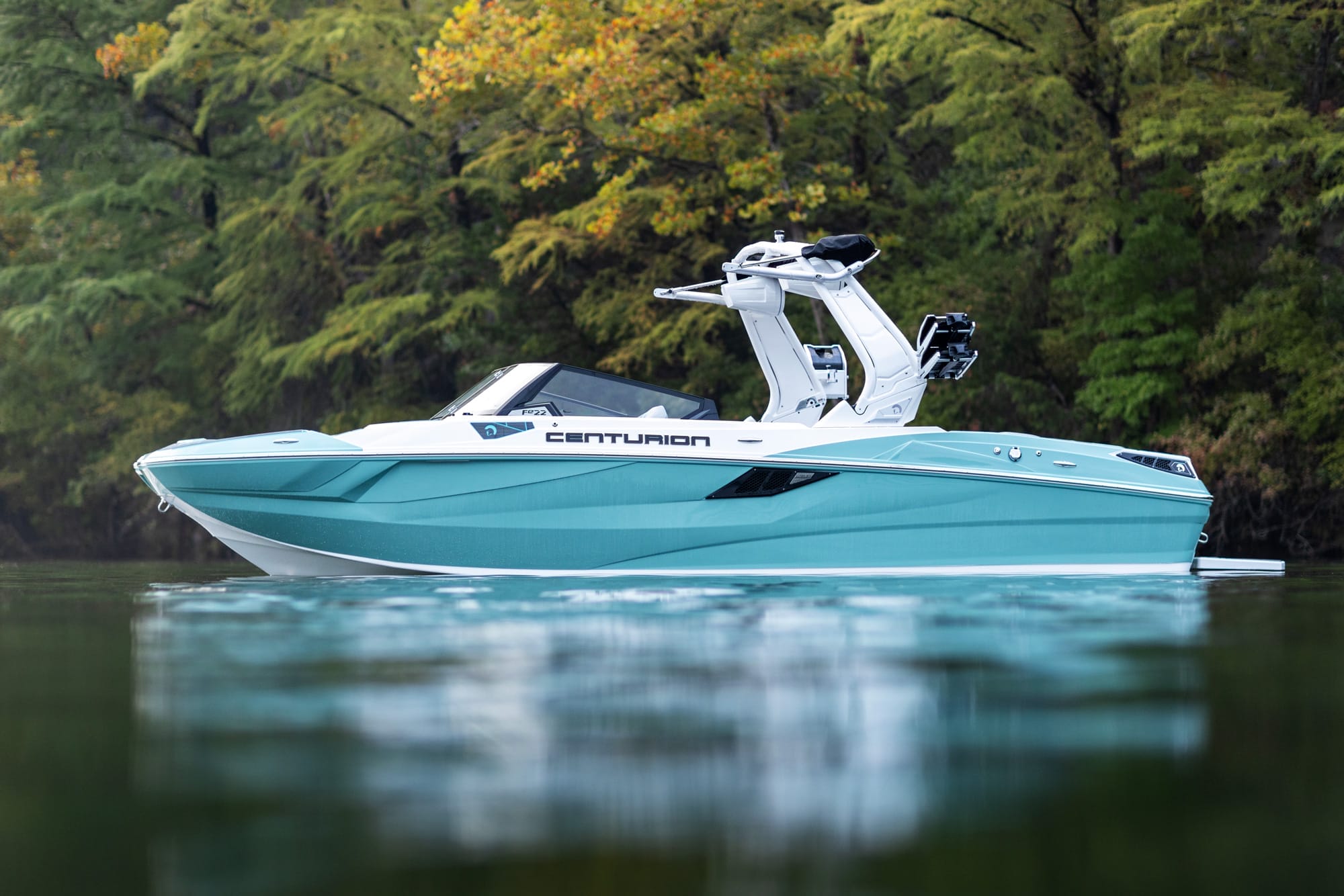 A blue and white boat on a body of water.