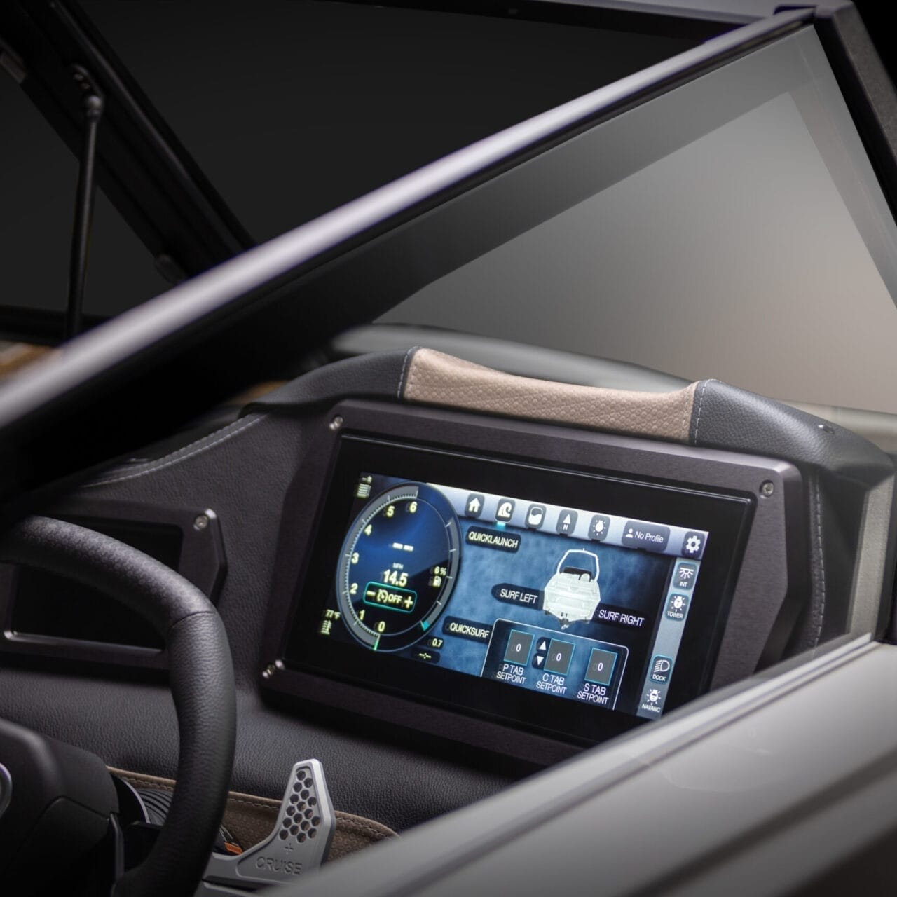 Close-up of a vehicle's dashboard featuring a digital instrument cluster and infotainment screen displaying various controls and information. Steering wheel and part of the windshield are visible.