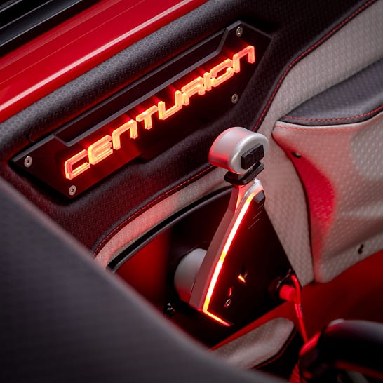 Close-up of a car interior featuring a glowing 