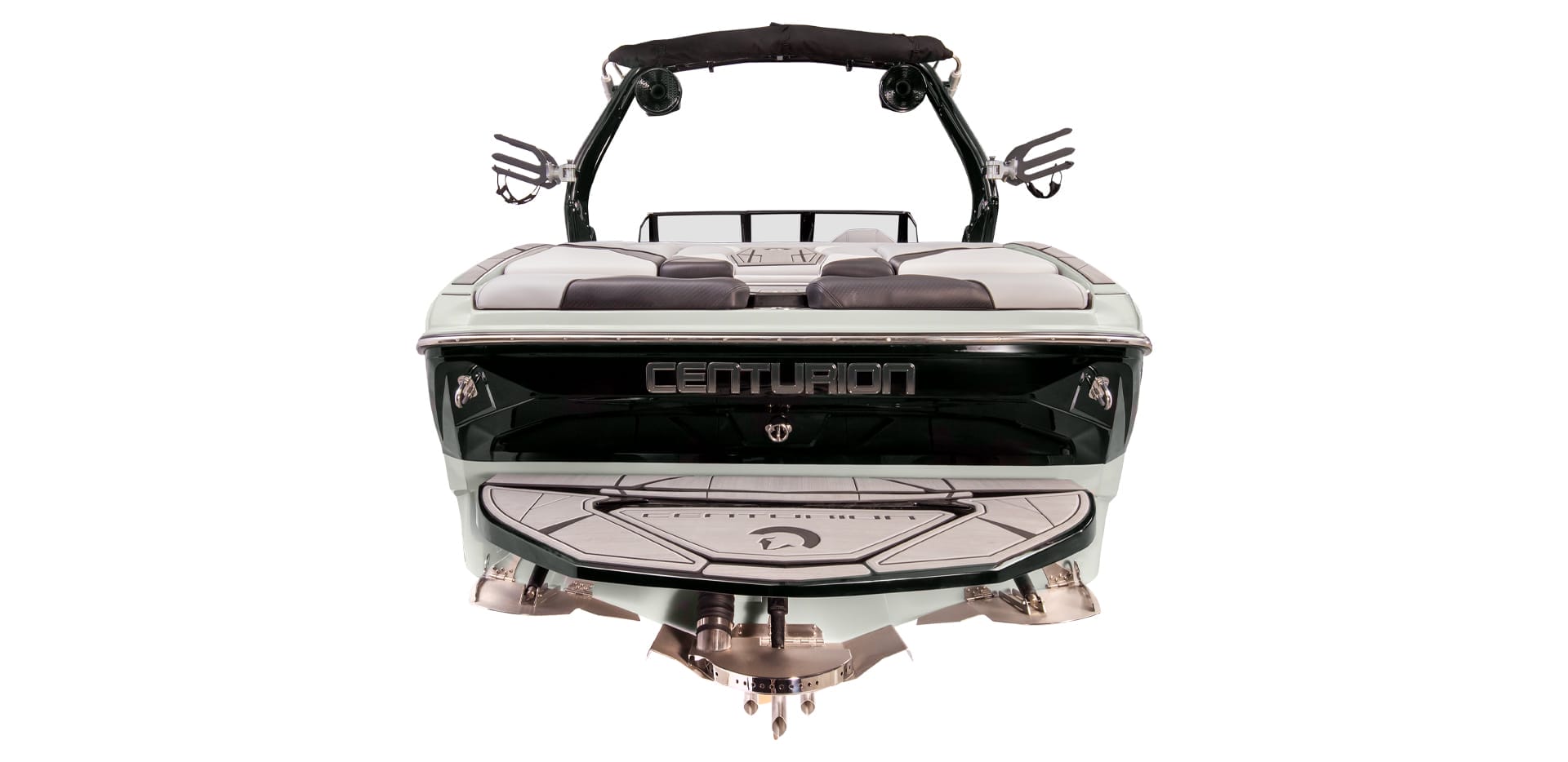 Rear view of a Centurion Nv233 towboat with a polished finish, featuring wakeboard racks, cushioned seating, and a swim platform.