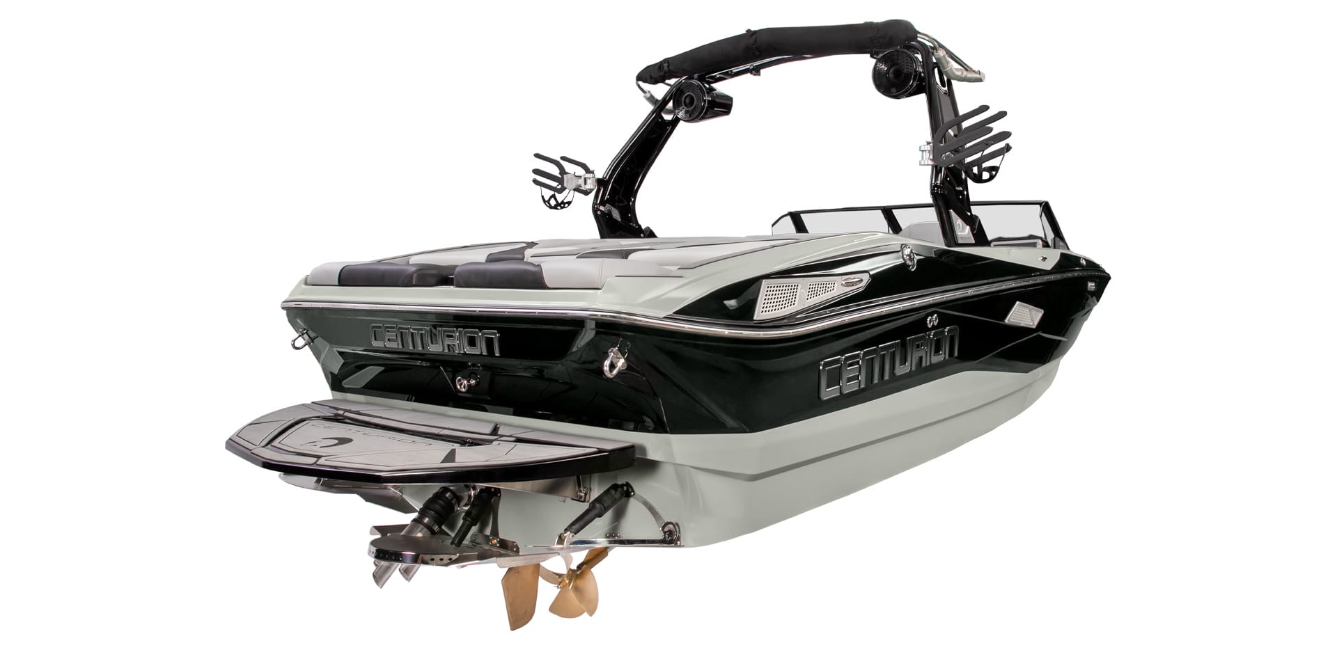 A black and white Centurion Nv233 towboard boat with a tower and wakeboard rack is elegantly viewed from the rear, showcasing its sleek design.