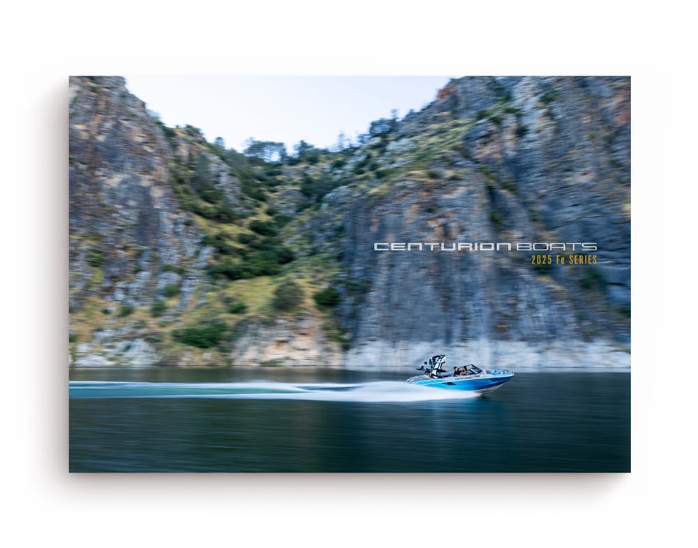 A speedboat on a lake moves quickly in front of rocky cliffs. The text reads 