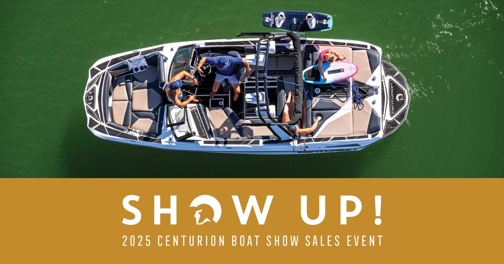 Aerial view of a boat with three people on board and two surfboards. Text reads "SHOW UP! 2025 Centurion Boat Show Sales Event.